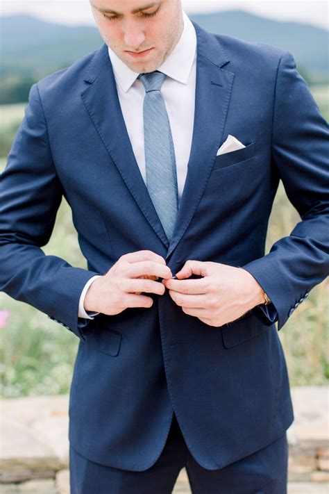 navy blue suit with dusty blue tie